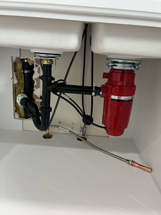 Installation and connection of a kitchen sink, garbage disposal, and faucet